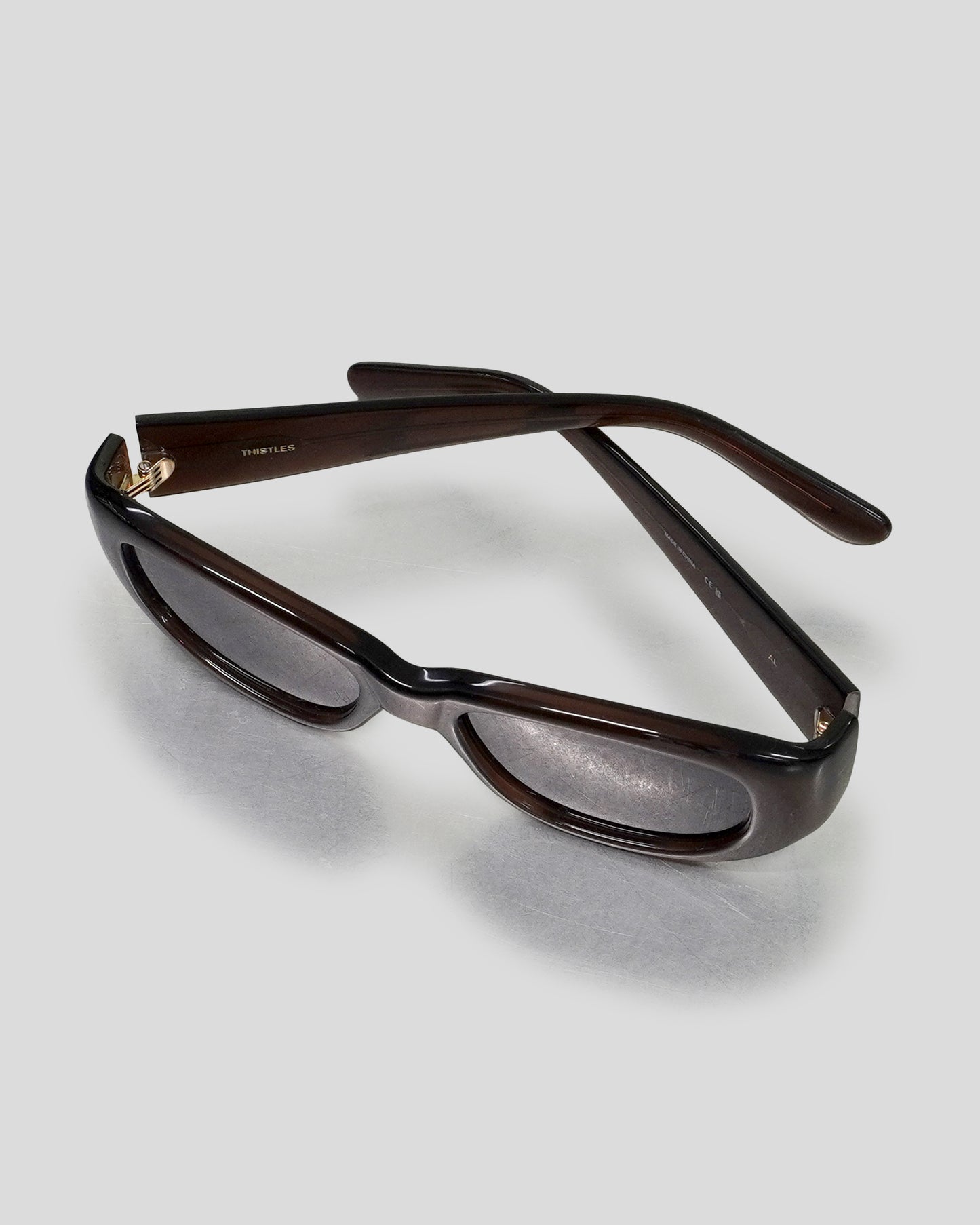 The Al with Crystal Brown frame and Black Lens