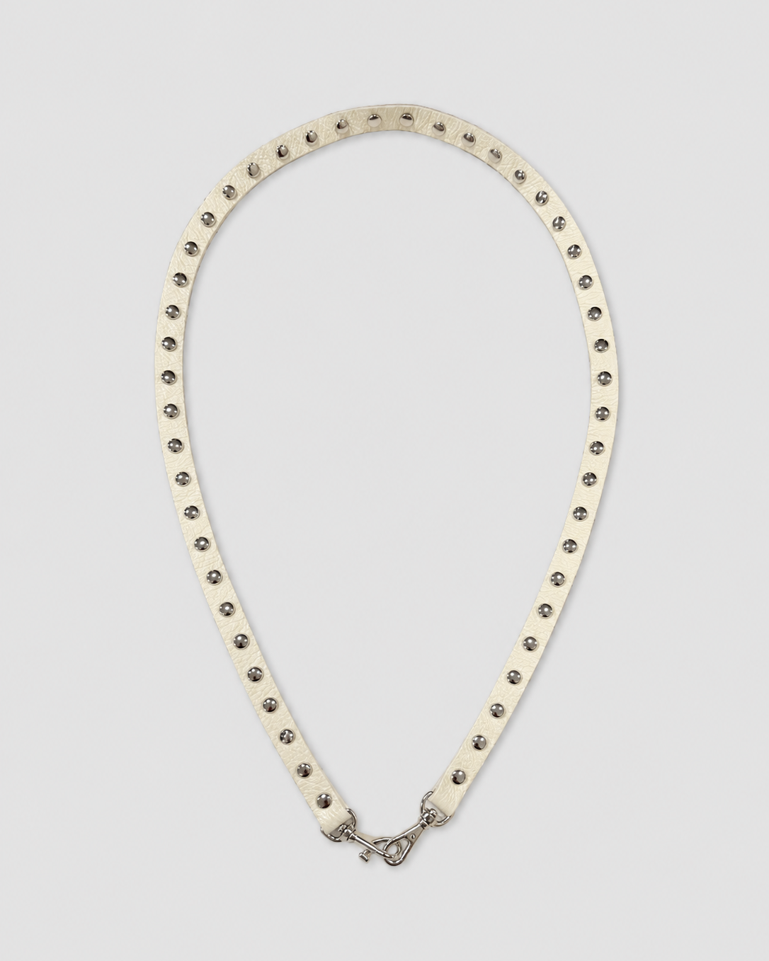 belt with studs on a light gray background